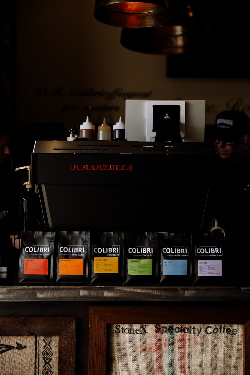 The espresso bar at night with the six roasts lined up along the counter